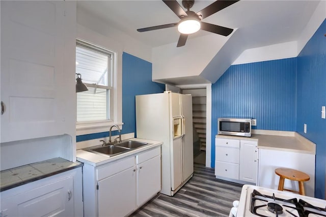 kitchen featuring white cabinetry, sink, ceiling fan, dark wood-type flooring, and white appliances