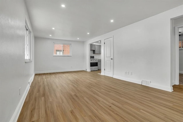 unfurnished living room with light hardwood / wood-style flooring