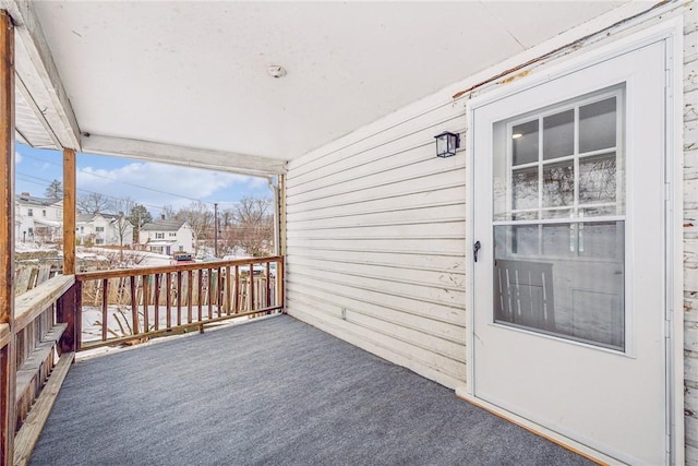 wooden deck with a residential view