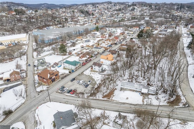 snowy aerial view with a residential view