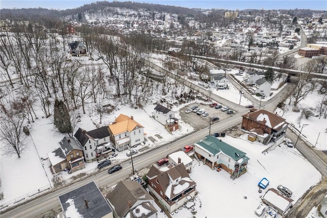 snowy aerial view with a residential view