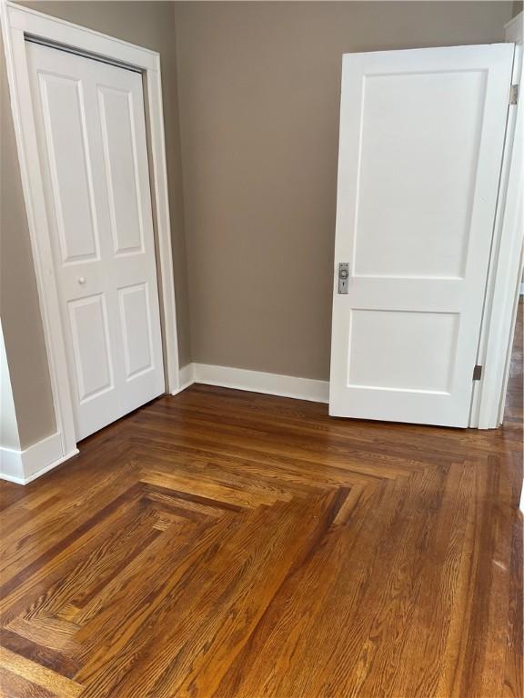 unfurnished bedroom featuring baseboards