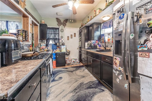 kitchen with ceiling fan, appliances with stainless steel finishes, sink, and plenty of natural light