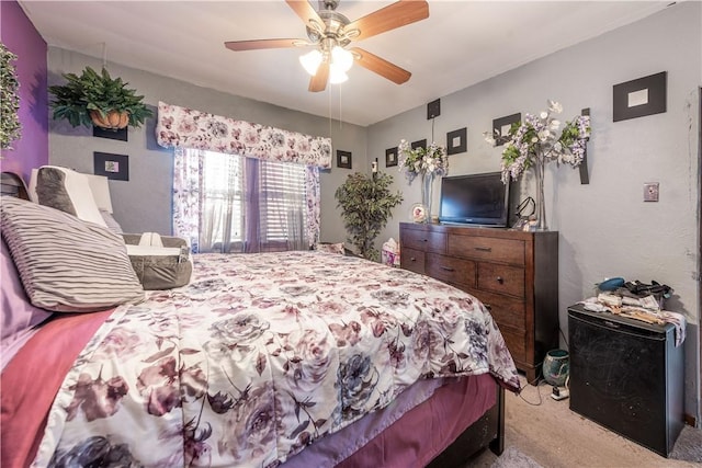 bedroom with ceiling fan and carpet