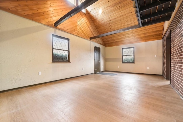 unfurnished room with wood ceiling, high vaulted ceiling, and light hardwood / wood-style floors