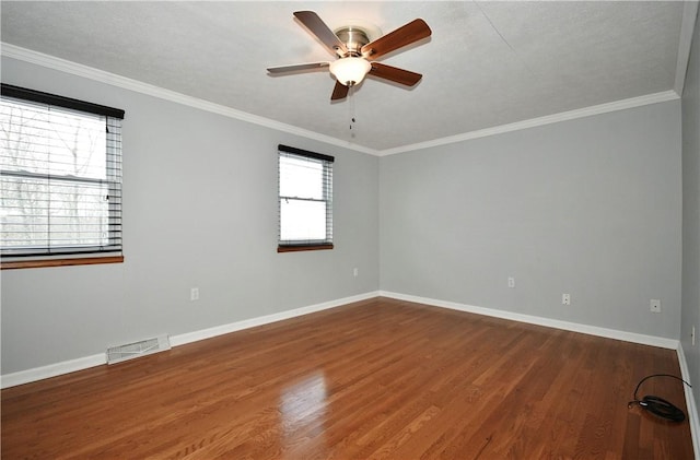 unfurnished room featuring ceiling fan, ornamental molding, and hardwood / wood-style floors