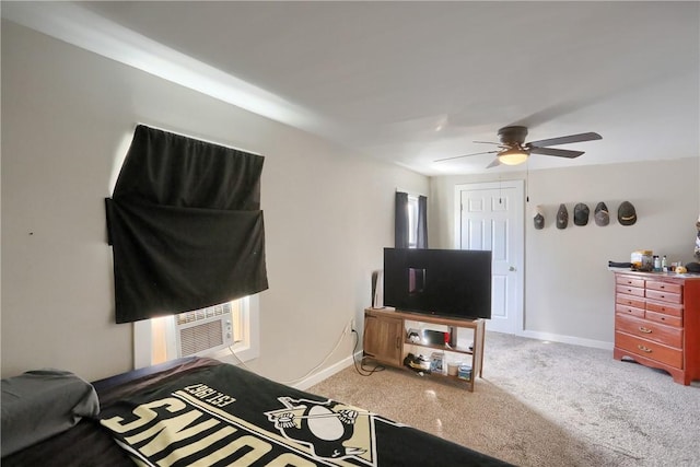 bedroom with cooling unit, light colored carpet, and ceiling fan