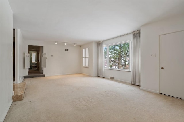 spare room with light colored carpet