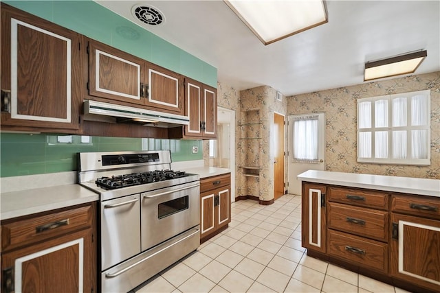 kitchen featuring light tile patterned flooring and double oven range