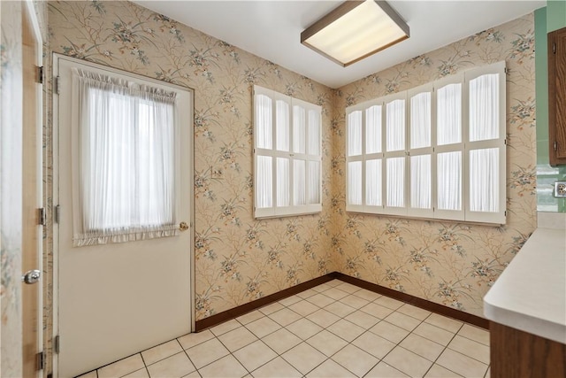 unfurnished room with light tile patterned floors