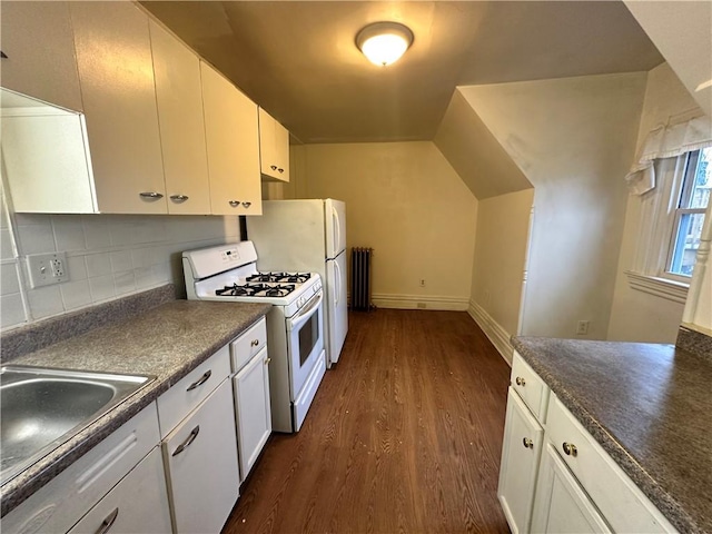 kitchen featuring sink, white cabinetry, tasteful backsplash, white gas range, and dark hardwood / wood-style flooring