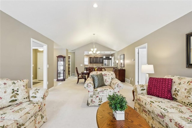 living room featuring lofted ceiling, light carpet, and a notable chandelier