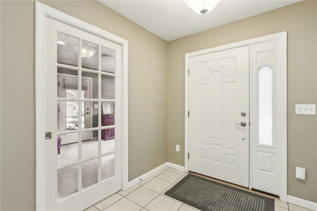 entrance foyer with light tile patterned floors