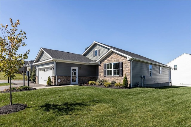 craftsman house with a garage and a front lawn