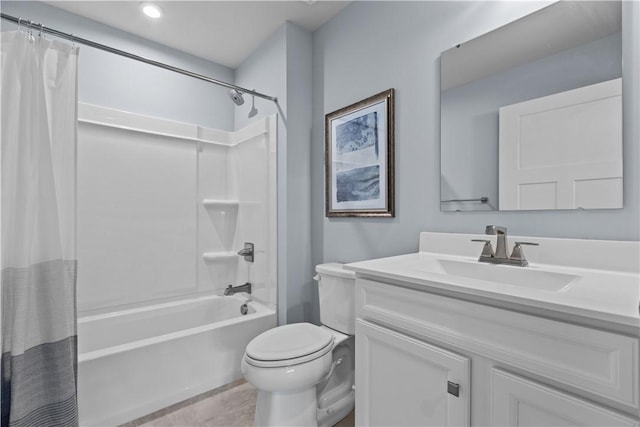 full bathroom with vanity, shower / tub combo, and toilet