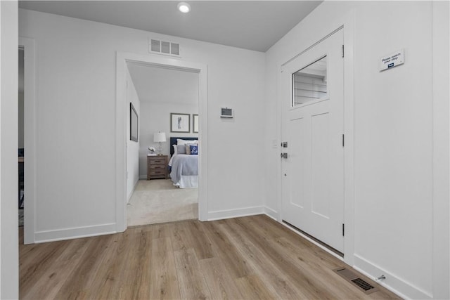 foyer entrance with light hardwood / wood-style flooring