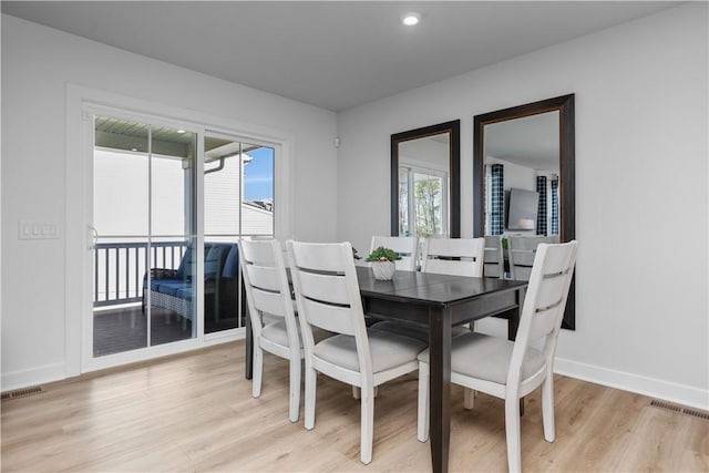 dining room with light hardwood / wood-style floors