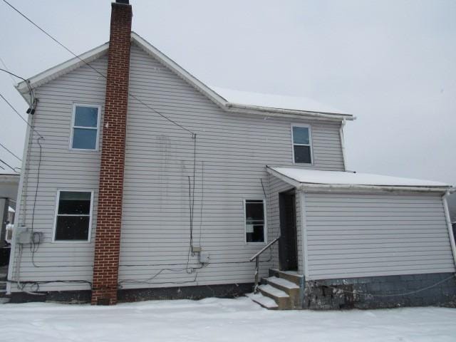 view of snow covered house