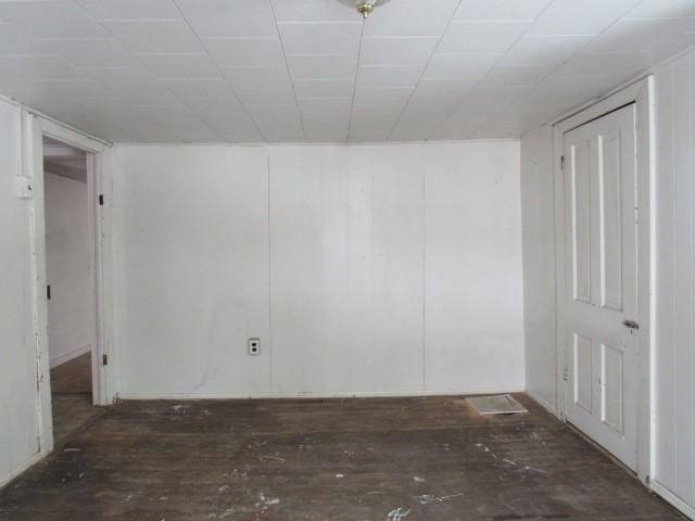 spare room featuring dark hardwood / wood-style flooring