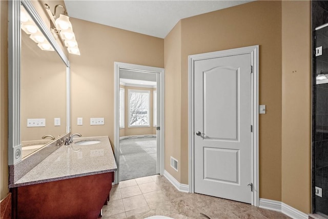 bathroom featuring vanity, an enclosed shower, and tile patterned flooring