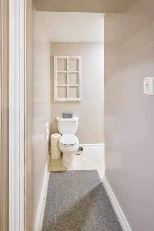 bathroom featuring tile patterned flooring and toilet