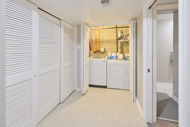 laundry room featuring washer and clothes dryer