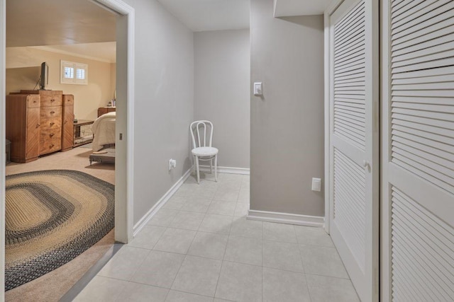 corridor with light tile patterned floors