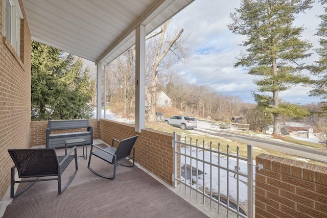 balcony featuring a porch