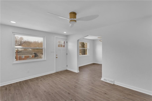 entryway with hardwood / wood-style flooring and ceiling fan