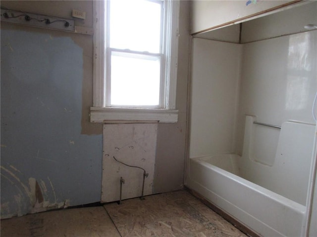 bathroom featuring a washtub