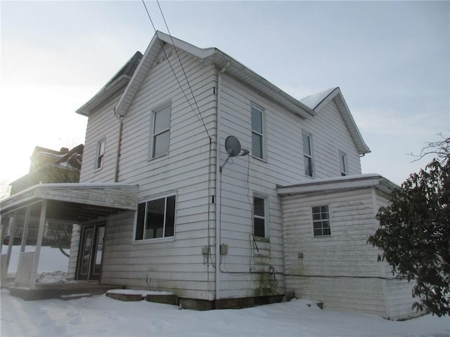 view of snow covered house