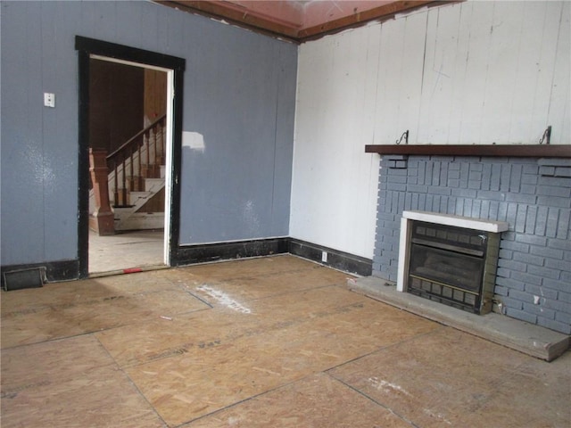 unfurnished living room featuring a fireplace