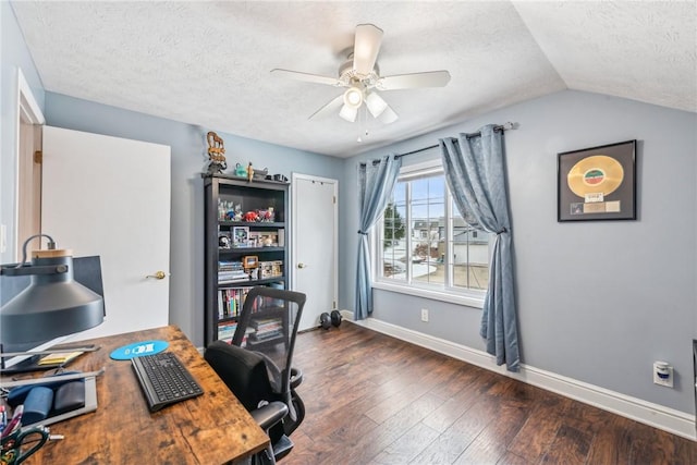 office space with ceiling fan, vaulted ceiling, a textured ceiling, and dark hardwood / wood-style flooring