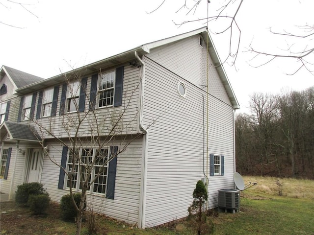 view of home's exterior with central AC