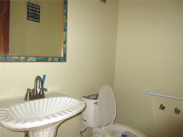 bathroom with sink and toilet