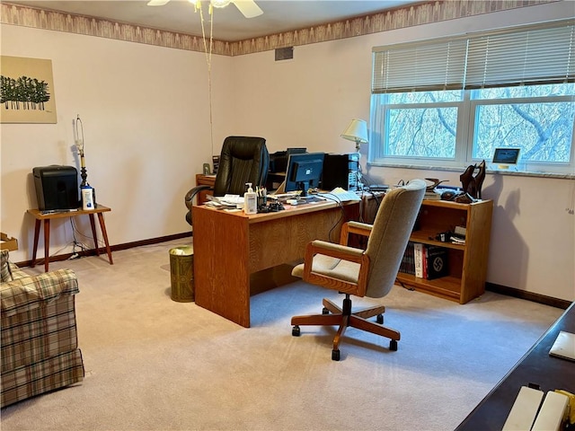 office space featuring carpet flooring, ceiling fan, and baseboards