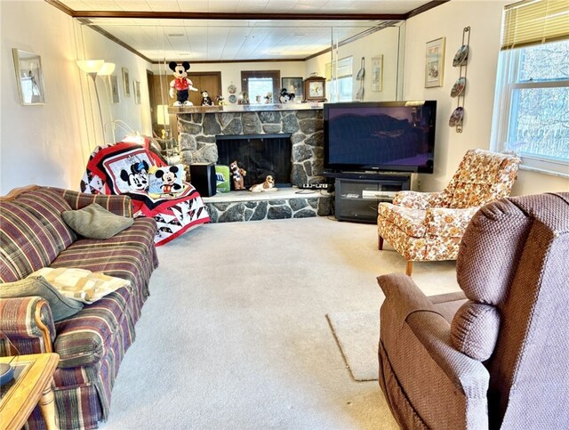 living room featuring ornamental molding, carpet, and a stone fireplace