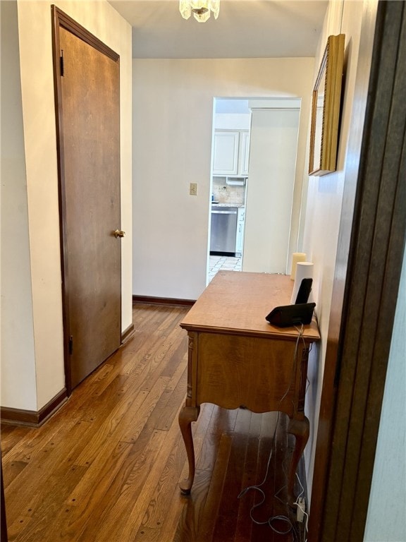 office featuring hardwood / wood-style flooring and baseboards