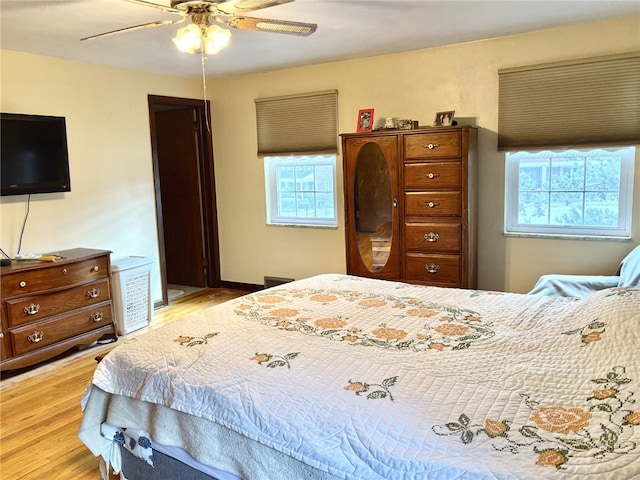 bedroom featuring a ceiling fan and light wood-type flooring