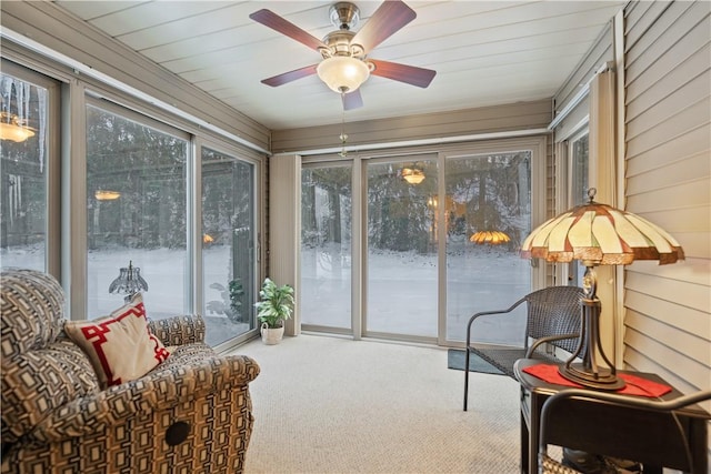 sunroom / solarium featuring ceiling fan