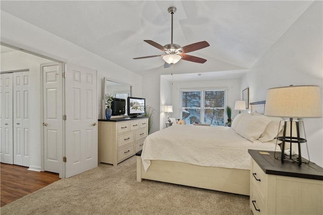 bedroom with lofted ceiling, light carpet, and ceiling fan