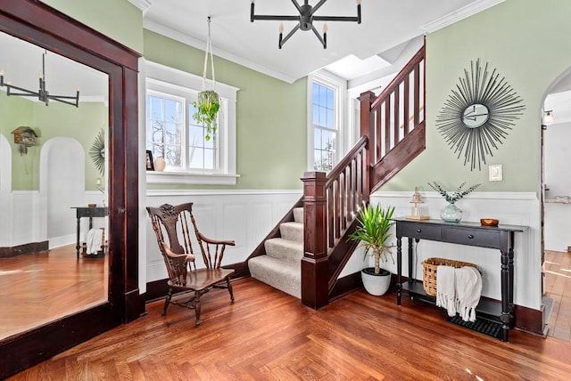 sitting room featuring parquet floors and crown molding