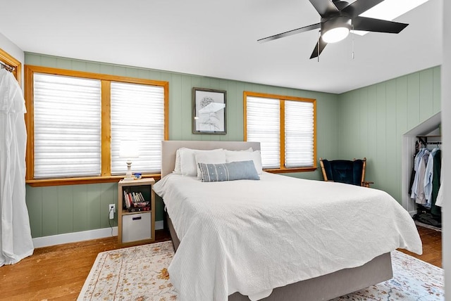 bedroom with ceiling fan and light wood-type flooring