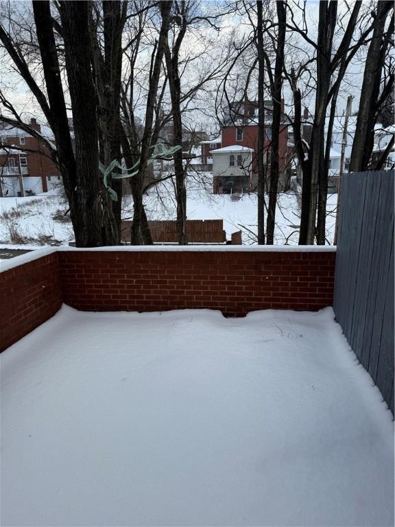 view of yard layered in snow