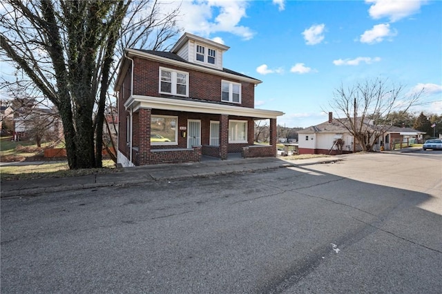 view of front of property featuring covered porch