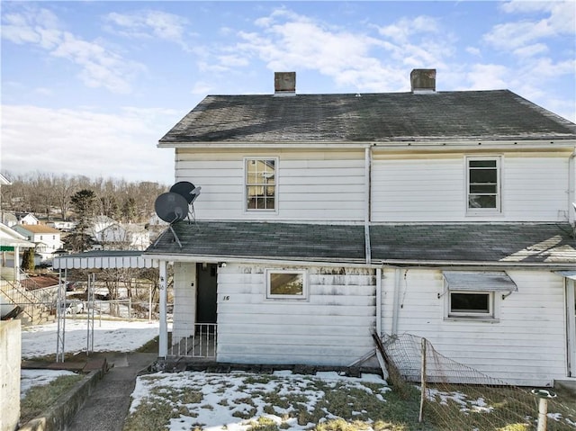 view of snow covered house