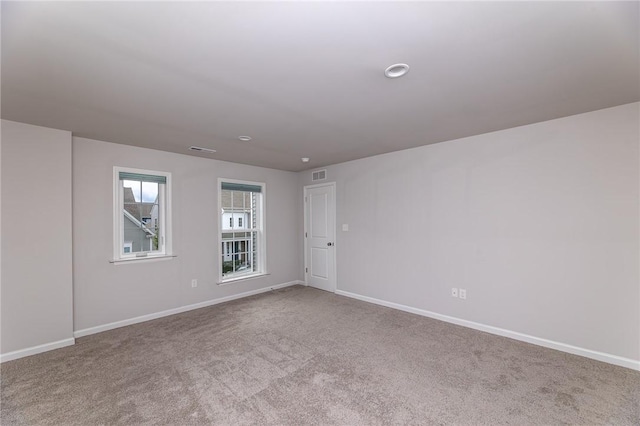 empty room with light colored carpet