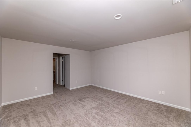 spare room with light colored carpet