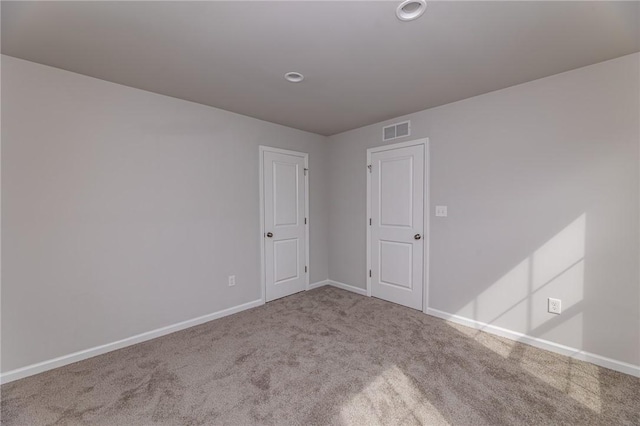 spare room with carpet floors