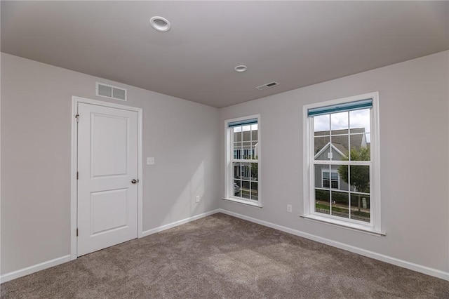 view of carpeted spare room